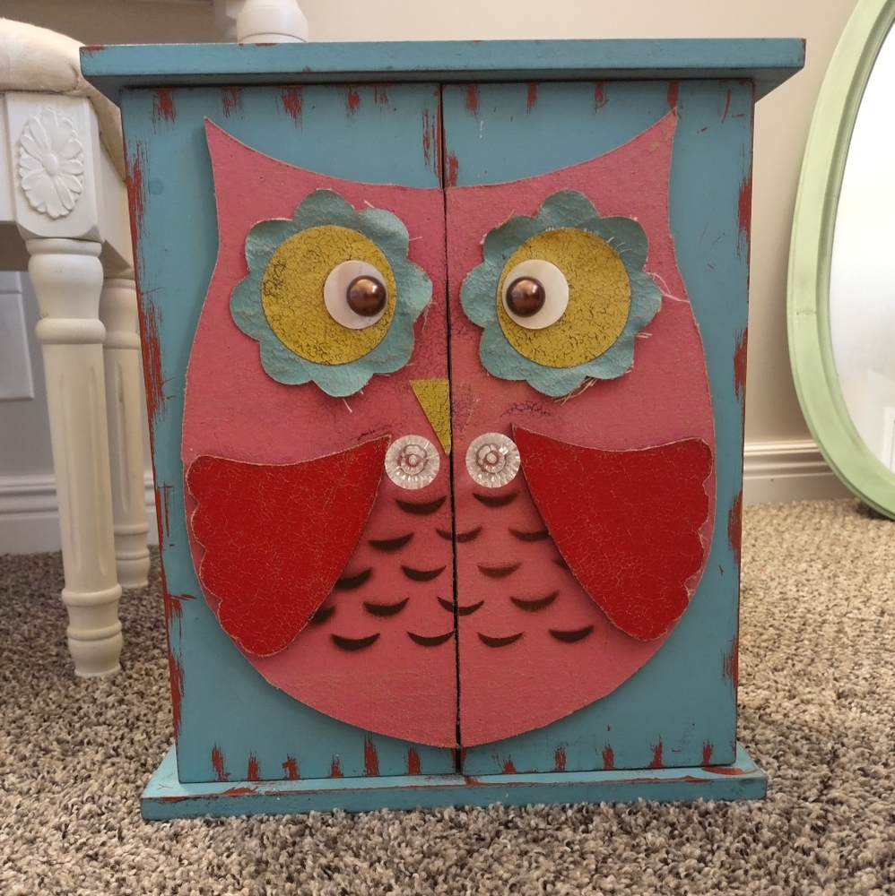 Distressed owl cabinet